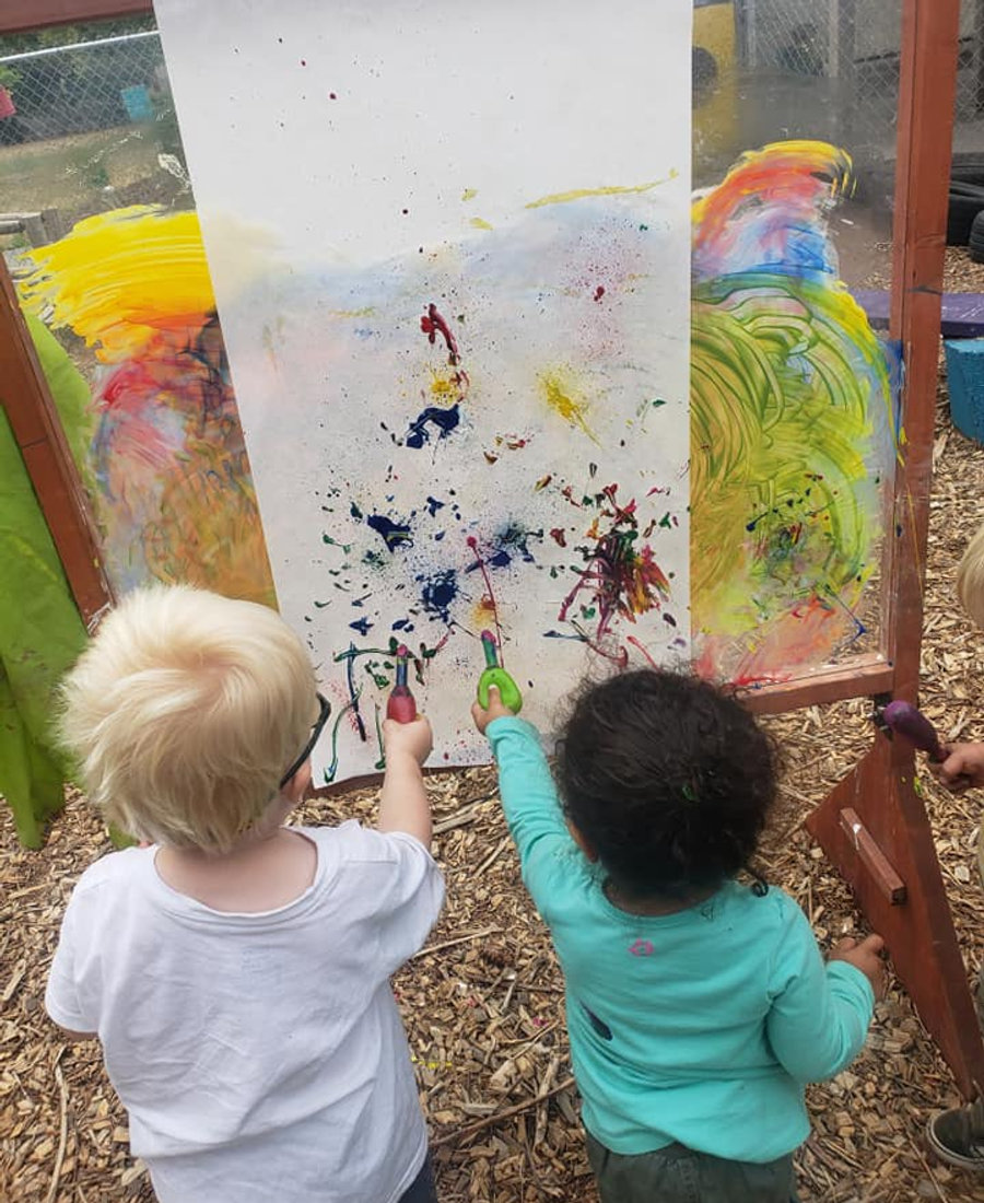 Children exploring outdoors at Journey School